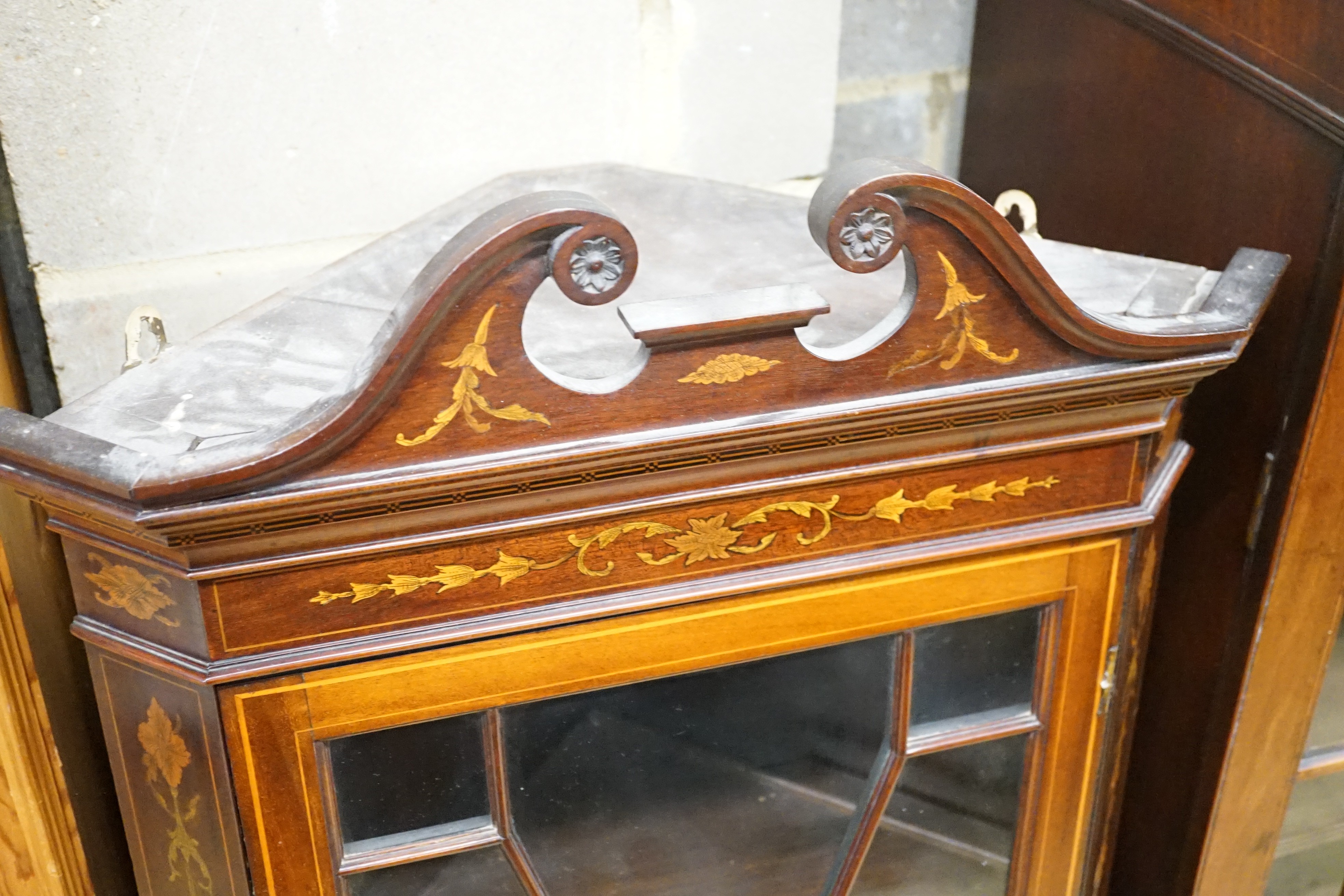 An Edwardian inlaid mahogany hanging corner cabinet, width 58cm, height 107cm